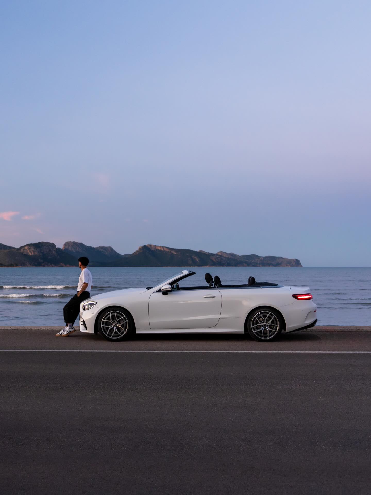 Waking up before the island does, driving along the Mallorcan coast with the roof down, the soft hum